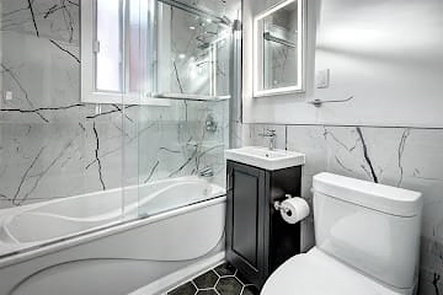 Luxury bathroom with glass vanity by Naybur Contracting